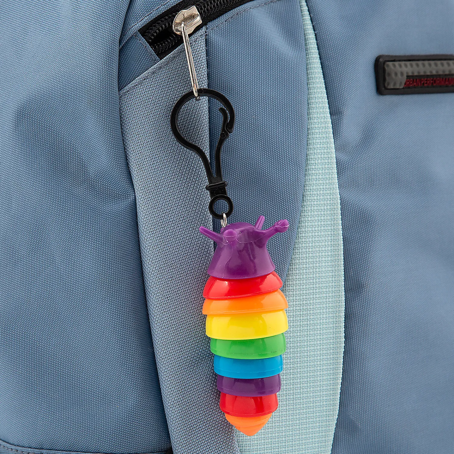 rainbow_fidget_slug_backp_1.webp Oriental Trading Fidget Toys & Spinners*Rainbow Fidget Slug Backpack Clip Keychains - 24 Pc.